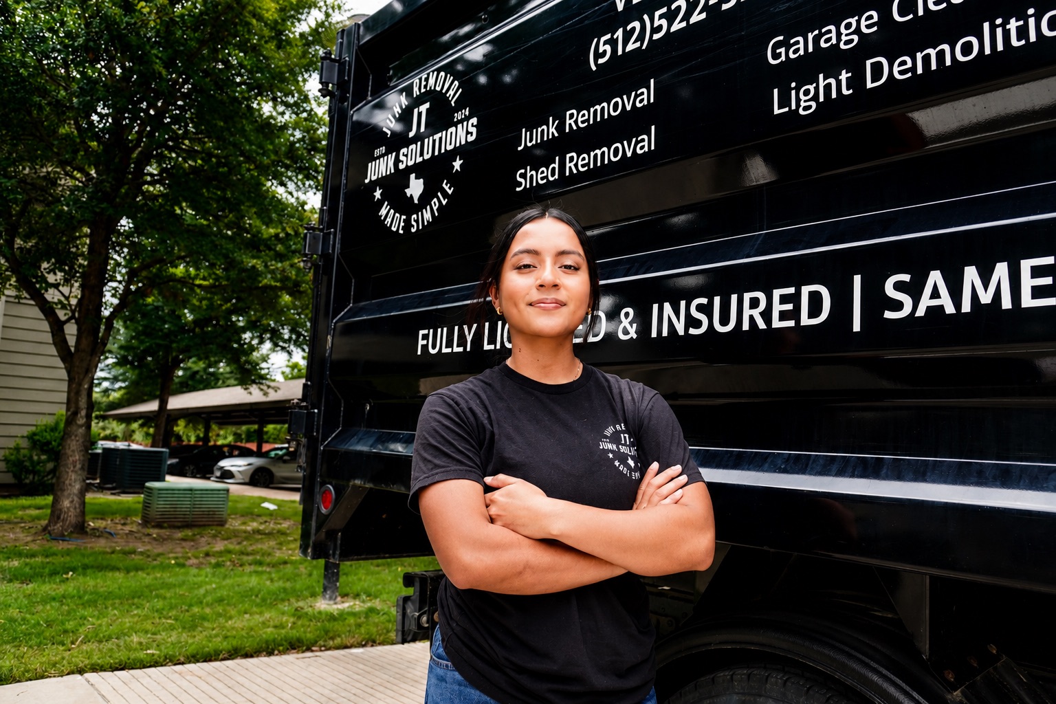 Jackie, co-founder of JT Junk Solutions, standing in front of the truck